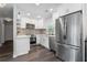 Modern kitchen with stainless steel appliances, granite countertops, and stylish backsplash at 6090 Heritage Se Way, Mableton, GA 30126