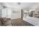 Cozy living space adjacent to the modern kitchen featuring hardwood floors and stylish decor at 6090 Heritage Se Way, Mableton, GA 30126