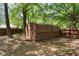 Backyard shed with wooden siding, providing additional storage space on the property at 6090 Heritage Se Way, Mableton, GA 30126