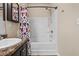 Bright bathroom featuring a shower-tub combo and granite vanity at 881 Ash St, Canton, GA 30114