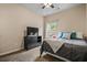 Cozy bedroom featuring a window view and a dresser with a TV at 881 Ash St, Canton, GA 30114