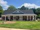 The clubhouse features a covered entrance and a fenced yard at 881 Ash St, Canton, GA 30114