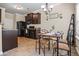 Warm dining area featuring dark wood cabinets, a charming table, and a bright window, perfect for Gathering meals at 881 Ash St, Canton, GA 30114