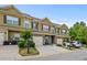 Inviting townhome showcasing a one-car garage and well-maintained landscaping for enhanced curb appeal at 881 Ash St, Canton, GA 30114