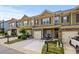 Beautiful townhome with a one-car garage and a welcoming front yard, creating a pleasant and inviting entrance at 881 Ash St, Canton, GA 30114
