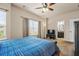 Beautiful main bedroom with a large window, tv, and entry into the main bathroom at 881 Ash St, Canton, GA 30114