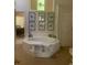 Relaxing bathroom featuring a soaking tub, natural light, and tiled surround at 1205 Rivershyre Ne Pkwy, Lawrenceville, GA 30043