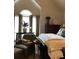 Comfortable bedroom with large windows, sitting chair, and ample natural light at 1205 Rivershyre Ne Pkwy, Lawrenceville, GA 30043
