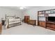 Spacious bedroom with a queen-sized bed, dresser and an open shelving unit at 1205 Rivershyre Ne Pkwy, Lawrenceville, GA 30043