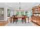 Charming dining area with wood table, chandelier, and windows with views to the outside at 1205 Rivershyre Ne Pkwy, Lawrenceville, GA 30043