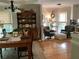 Charming dining area featuring a wooden table, chairs, built-in cabinet, and ample natural light from multiple windows at 1205 Rivershyre Ne Pkwy, Lawrenceville, GA 30043
