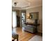 Welcoming foyer with hardwood floors, a console table with decor, and an adjacent living space with ample natural light at 1205 Rivershyre Ne Pkwy, Lawrenceville, GA 30043
