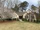 Inviting single-story home with a well-manicured lawn and mature flowering trees in a lovely setting at 1205 Rivershyre Ne Pkwy, Lawrenceville, GA 30043