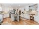 Spacious kitchen featuring stainless appliances, white cabinetry, and hardwood floors at 1205 Rivershyre Ne Pkwy, Lawrenceville, GA 30043