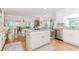 Open kitchen with granite island, modern stainless steel appliances, and hardwood floors at 1205 Rivershyre Ne Pkwy, Lawrenceville, GA 30043