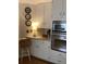 Kitchen showcases custom cabinetry, granite countertops, and stainless steel appliances at 1205 Rivershyre Ne Pkwy, Lawrenceville, GA 30043
