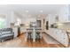 Light, bright, open kitchen features stainless appliances and a kitchen island at 1205 Rivershyre Ne Pkwy, Lawrenceville, GA 30043