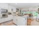 Charming kitchen featuring white cabinetry, an island cooktop, and stainless-steel appliances at 1205 Rivershyre Ne Pkwy, Lawrenceville, GA 30043