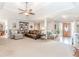 Spacious open-concept living area featuring hardwood floors, modern furniture, and ample natural light at 1205 Rivershyre Ne Pkwy, Lawrenceville, GA 30043