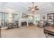 Bright and airy living room featuring large windows, a fireplace, and neutral decor at 1205 Rivershyre Ne Pkwy, Lawrenceville, GA 30043