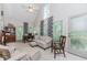 Cozy living area features vaulted ceiling, natural light, and views of the surrounding greenery at 1205 Rivershyre Ne Pkwy, Lawrenceville, GA 30043