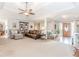 Inviting living room with a tray ceiling, plush seating, and seamless flow into the entryway at 1205 Rivershyre Ne Pkwy, Lawrenceville, GA 30043