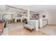 Bright and airy living room with a fireplace, large windows, hardwood, and carpet floors at 1205 Rivershyre Ne Pkwy, Lawrenceville, GA 30043