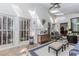 Bright sun room with wood floors, white trim, and light furniture at 1205 Rivershyre Ne Pkwy, Lawrenceville, GA 30043