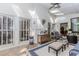 Bright sunroom with skylights, paneled walls, wide windows, and cozy seating at 1205 Rivershyre Ne Pkwy, Lawrenceville, GA 30043