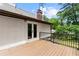 Back deck area with railings and outdoor seating space perfect for entertaining at 1887 Shalimar Dr, Atlanta, GA 30345