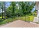 Back deck overlooking a lush backyard with mature trees, and landscaping at 1887 Shalimar Dr, Atlanta, GA 30345