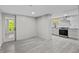 Open-concept basement area including space for dining and a kitchen with stainless steel appliances at 1887 Shalimar Dr, Atlanta, GA 30345