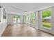Bright sunroom in basement with multiple windows and wood-look flooring at 1887 Shalimar Dr, Atlanta, GA 30345