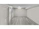 Finished basement area with light gray floors, fresh paint, and closet space at 1887 Shalimar Dr, Atlanta, GA 30345
