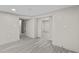 Spacious basement area featuring light gray flooring, fresh paint, and neutral-toned walls and trim at 1887 Shalimar Dr, Atlanta, GA 30345