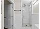 Bright bathroom with shower that features stylish marble-like tiling and a glass enclosure at 1887 Shalimar Dr, Atlanta, GA 30345