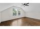 Spacious bedroom featuring beautiful hardwood floors, two large windows offering an abundance of natural light, and a ceiling fan at 1887 Shalimar Dr, Atlanta, GA 30345
