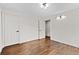 This bedroom has wood floors and neutral colored walls at 1887 Shalimar Dr, Atlanta, GA 30345