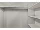 Walk-in closet featuring built-in shelving and rod for ample storage at 1887 Shalimar Dr, Atlanta, GA 30345