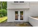Basement walkout featuring double doors and access to backyard at 1887 Shalimar Dr, Atlanta, GA 30345