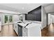 Spacious kitchen with an island that has white quartz countertops, stainless steel appliances and hardwood floors at 1887 Shalimar Dr, Atlanta, GA 30345