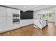 Modern kitchen with stainless steel appliances, white cabinets and an island with white quartz countertops at 1887 Shalimar Dr, Atlanta, GA 30345