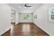 Bright and airy living room featuring hardwood floors, a ceiling fan, and plenty of natural light at 1887 Shalimar Dr, Atlanta, GA 30345