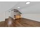 Bright living space with hardwood floors, recessed lighting and a wet bar with stone backsplash and natural wood cabinets at 1887 Shalimar Dr, Atlanta, GA 30345