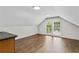 Spacious living space with hardwood floors, recessed lighting, and natural light pouring in from windows with wooded views at 1887 Shalimar Dr, Atlanta, GA 30345