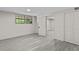 View of the room with light gray flooring, featuring access to another room and double-door closet at 1887 Shalimar Dr, Atlanta, GA 30345