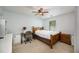 Neutral bedroom features carpeted floors, a ceiling fan and a window for lots of natural light at 2507 Albion Farm Way, Duluth, GA 30097
