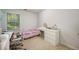 Bright bedroom with carpeted floors and a window giving plenty of natural light at 2507 Albion Farm Way, Duluth, GA 30097