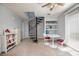 Bonus room with spiral staircase and sliders to exterior. Neutral walls and modern fixtures at 2507 Albion Farm Way, Duluth, GA 30097