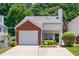 Charming home with a brick facade, attached garage, and well-maintained landscaping at 2507 Albion Farm Way, Duluth, GA 30097